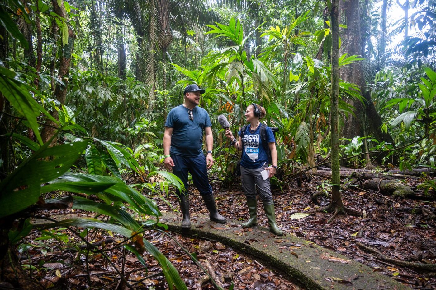 Two researchers standing in lowland rainforest at La Selva